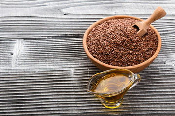 flaxseed and oil on a rustic background