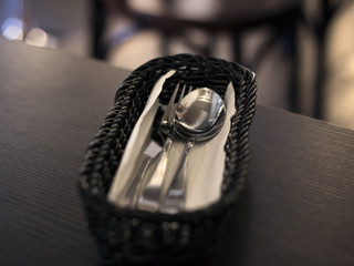 Spoon, fork and knife in the basket