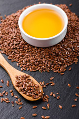 flaxseed and oil on a rustic background