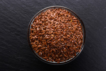 flaxseed and oil on a rustic background