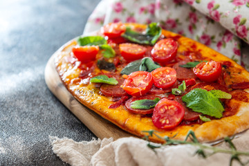Sausage Pizza with Ham and tomatoes