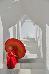 A Buddhist novice monk at white temple