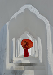 A Buddhist novice monk at white temple