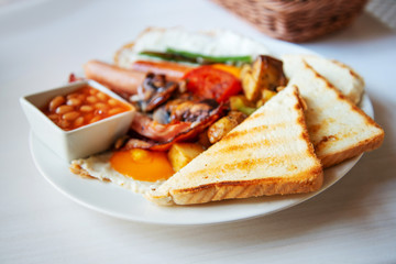 Egg and Toast - classical english breakfast with egg and ham