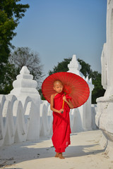 A Buddhist novice monk at white temple