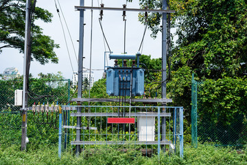 Electric transformer in side road at India.