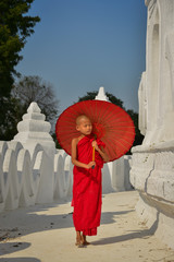 A Buddhist novice monk at white temple