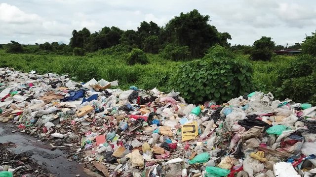 Plastic garbage pollution beside poor shanty town in Malaysia 