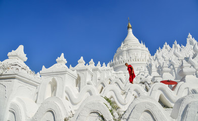 A Buddhist novice monk at white temple