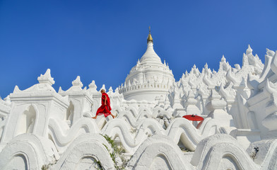 A Buddhist novice monk at white temple