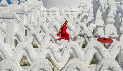 A Buddhist novice monk at white temple