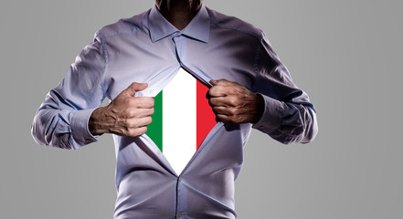 Business man with italian flag on gray background 