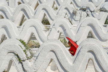 A Buddhist novice monk at white temple