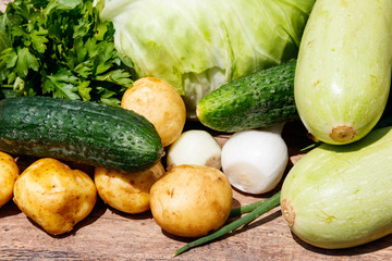 Fresh vegetables on rustic wooden table outdoor