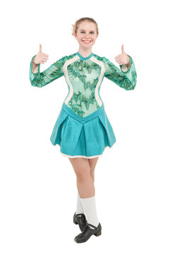 Beautiful woman in dress for Irish dance showing thumbs up isolated