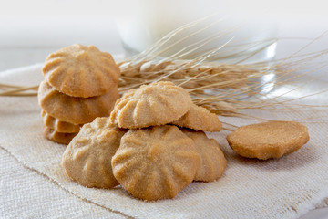 Dairy milk with home made cookies over white background