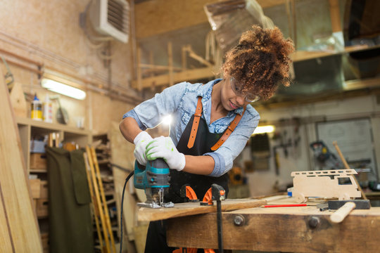 Afro american woman craftswoman working in her workshop

