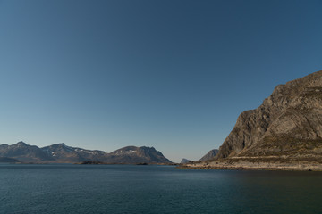 Fototapeta premium Aerial view over the Rorvikstranda beach and Gimsoystraumen fjord near Henningsvaer at Lofoten Islands / Norway