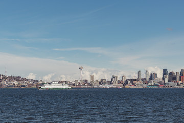 Fototapeta na wymiar Seattle city skyline from Alki Beach in Washington with ferry and Space Needle