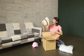 woman unboxing at home