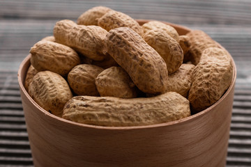 fresh peanuts on a wooden rustic background