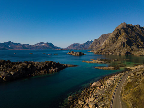 Aerial view over the Rorvikstranda beach and Gimsoystraumen fjord near Henningsvaer at Lofoten Islands / Norway