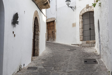 Fototapeta na wymiar Solitary street, winter day in historic center of Ibiza. Balearic islands,Spain.