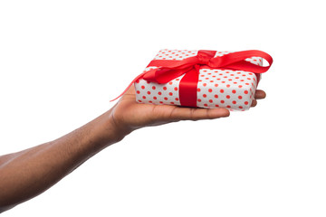 Black man holding gift box isolated on white background