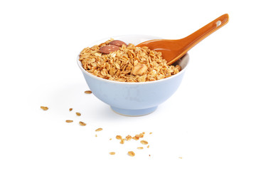Bowl of whole grain muesli isolated on white background