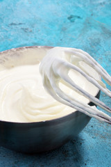 close up of a white whipped or sour cream in bowl.