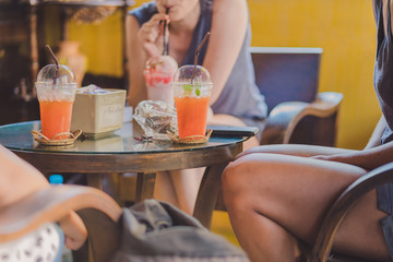 Girl adventurers have a great time in the coffee shop.