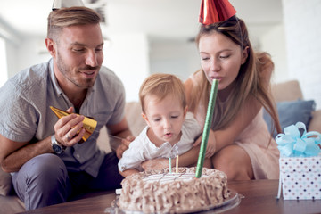 Family celebrating birthday at home