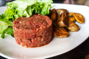 tasty Steak tartare (Raw beef) - classic steak tartare on white plate