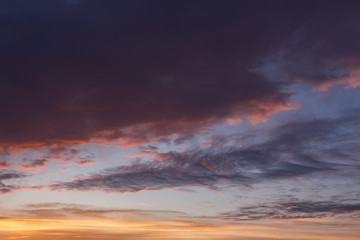 Colorful clouds on evening sky at sunset background.