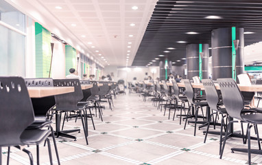 Modern interior of cafeteria or canteen with chairs and tables - obrazy, fototapety, plakaty