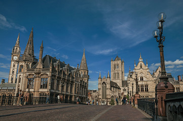 Fototapeta na wymiar St Michael's Bridge, churches and Gothic buildings in Ghent. In addition to intense cultural life, the city is full of canals and Flemish architecture. Northern Belgium.