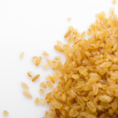raw bulgur on a white acrylic background