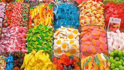 Assorted colorful jelly candies on display at La Boqueria market, Barcelona