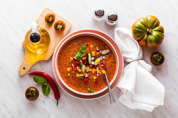 Traditional spanish andalusian tomato cream soup - salmorejo. Salmorejo or gazpacho cream soup on gray bowl