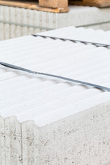 Concrete blocks on palette on building construction site