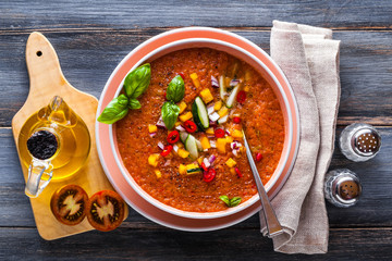 Traditional spanish andalusian tomato cream soup - salmorejo. Salmorejo or gazpacho cream soup on gray bowl