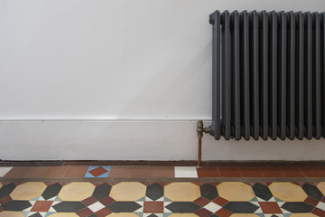 House entrance hall with period feature victorian tiles and radiator