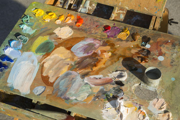 Artist's board with paints. Abstract background (artist's sketch board)
