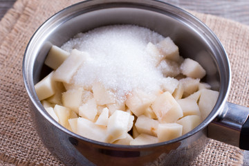 Cooked pear jam in a pan boiling with sugar