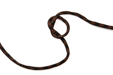 Knot on shoelace. Isolated on white background.