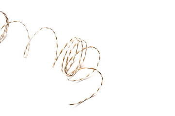 String coils on white background.