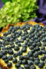 Tart with cream and blueberries