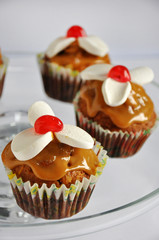 Muffins with caramel on glass
