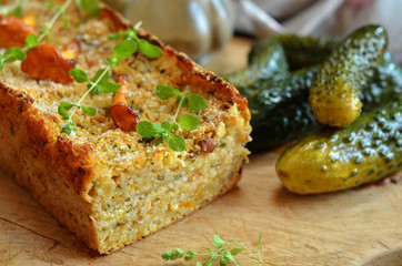 Vegetarian lentil pate on a wooden board. Freshly pickled cucumbers on a wooden board