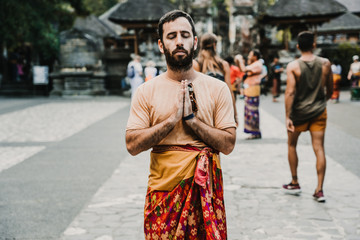 Fototapeta na wymiar .Young and cheerful tourist enjoying the island of Bali in Indonesia. Knowing ancient Hindu temples, very spiritual places. Travel Photography. Lifestyle..